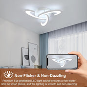 Ceiling light fixture in a room with a smartphone displaying the brand logo.