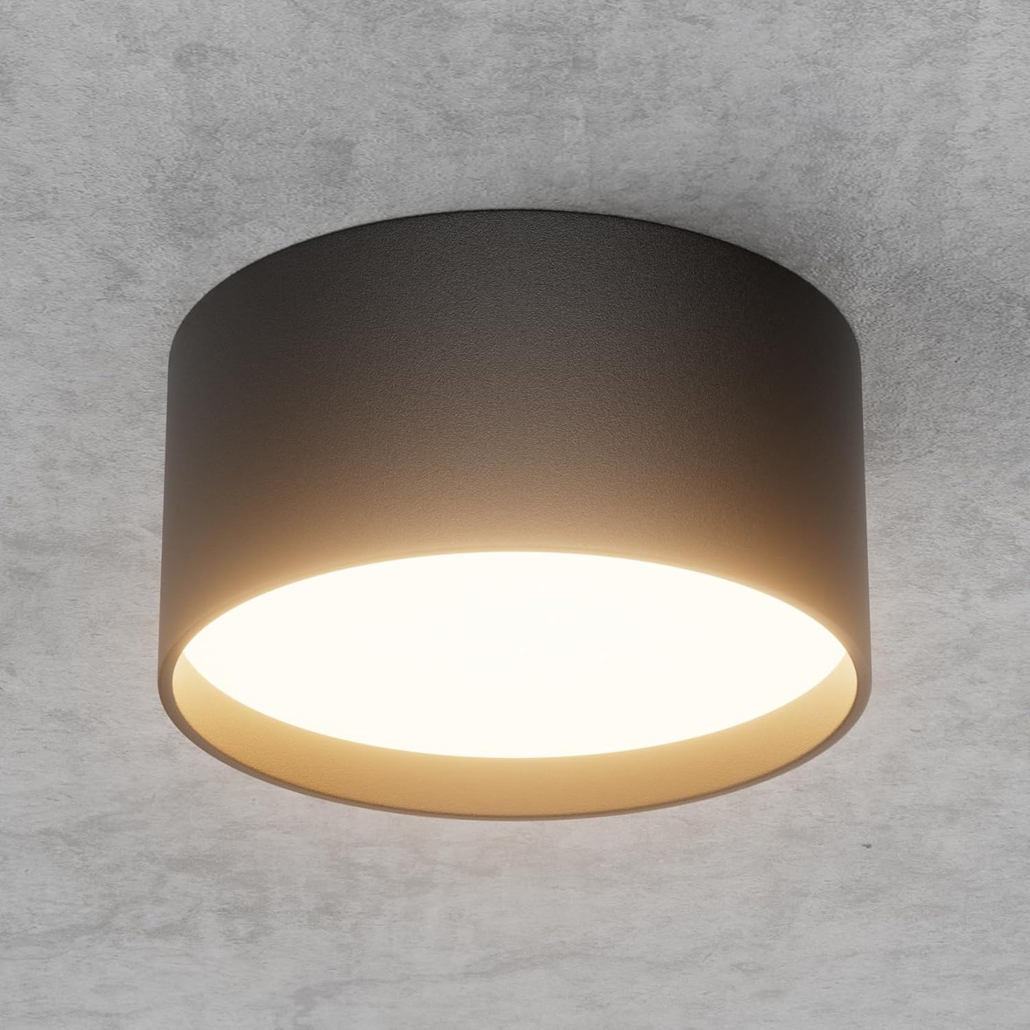 Ceiling light fixture on a gray concrete wall
