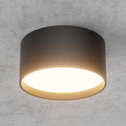 Ceiling light fixture on a gray concrete wall
