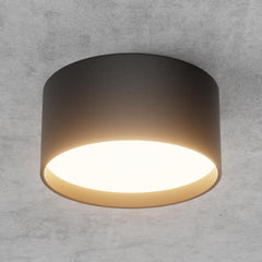 Ceiling light fixture on a gray concrete wall