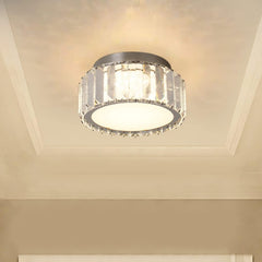 Ceiling light fixture with crystal accents on a beige ceiling