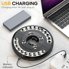 Circular charging device with USB cable connected to a laptop on a white surface.