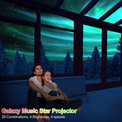 Couple sitting on a couch in a room with a galaxy-themed ceiling projection.