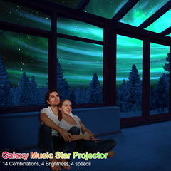 Couple sitting on a couch in a room with a galaxy-themed projector display.