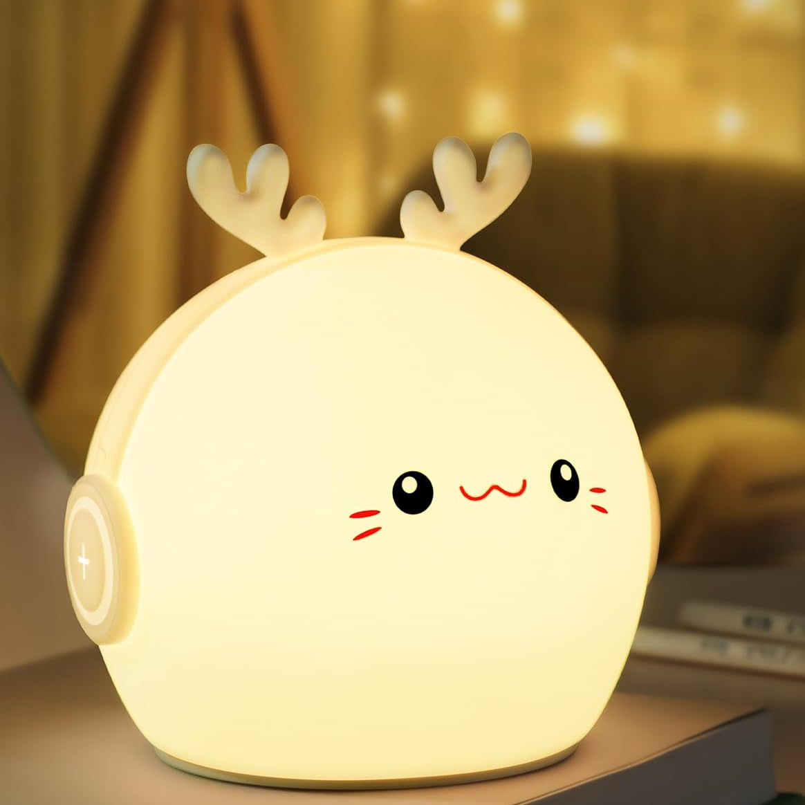 Cute deer-shaped night light on a surface with a blurred background