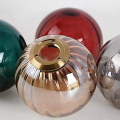Decorative glass knobs with gold centers on a white background