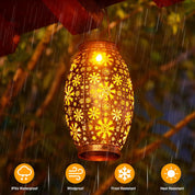 Decorative lantern with floral pattern hanging outdoors in rain, featuring IPX4 waterproof, windproof, frost resistant, and heat resistant icons.