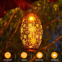 Decorative lantern with floral pattern hanging outdoors in rain, featuring IPX4 waterproof, windproof, frost resistant, and heat resistant icons.
