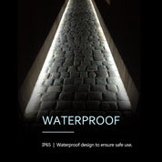 Light fixture with waterproof design text on a dark background