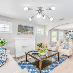 Living room with beige sofas, a coffee table, and decorative items.