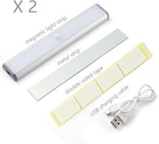 Magnetic light strip with metal strip, double-sided tape, and USB charging cable on a white background