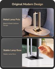 Metal lamp pole with black and gold collision design on a marble base, shown in a living room setting.