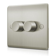 Metallic light switch with two knobs on a white background