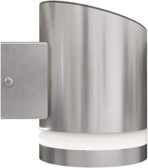 Metallic wall light fixture on a white background