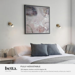 Modern bedroom with a bed, abstract art, and wall lights, featuring the brand 'betta'.