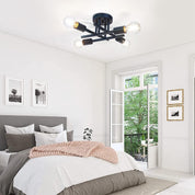 Modern bedroom with a ceiling light fixture, bed, and open door leading to a balcony.