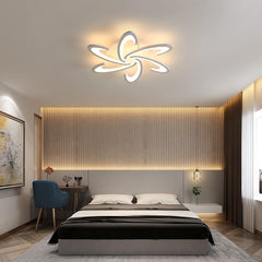 Modern bedroom with a decorative ceiling light fixture.