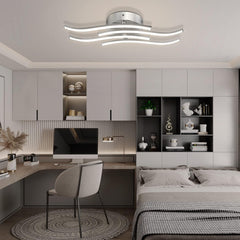 Modern bedroom with ceiling light fixture, bed, and desk.