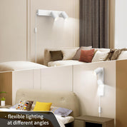Modern bedroom with flexible wall-mounted lamp and beige sofa.