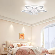 Modern bedroom with a decorative ceiling light fixture.