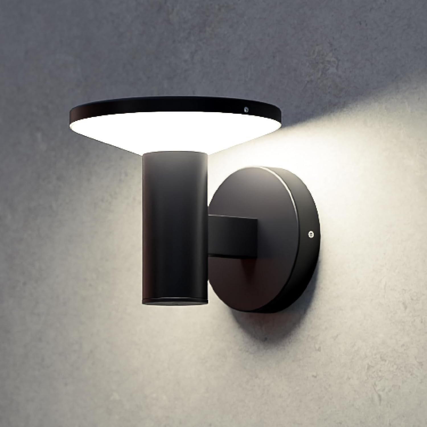 Modern black wall-mounted light fixture on a gray wall