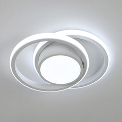 Modern ceiling light fixture with circular design on a neutral background