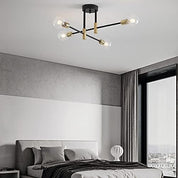 Modern ceiling light fixture in a bedroom setting with a bed and window in the background.