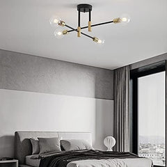 Modern ceiling light fixture in a bedroom setting with a bed and window in the background.