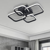 Modern ceiling light fixture in a room with gray walls and a window.