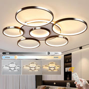 Modern ceiling light fixture with adjustable color temperature control in a home setting.