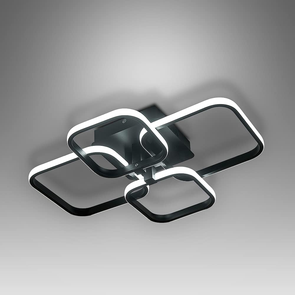 Modern ceiling light fixture with black and white design on a gray background