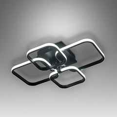 Modern ceiling light fixture with black and white design on a gray background