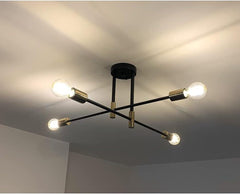 Modern ceiling light fixture with four bulbs on a ceiling