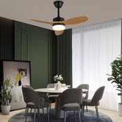 Modern dining room with a ceiling fan, table, and chairs.