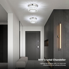 Modern hallway with ceiling lights and wall sconce, featuring a mini crystal chandelier.