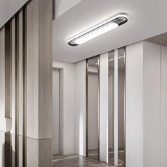 Modern interior design with a ceiling light fixture in a hallway.