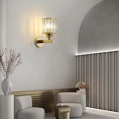 Modern interior with wall sconce, gray sofa, and decorative elements.
