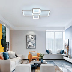 Modern living room with ceiling lights, sofa, and decorative elements.