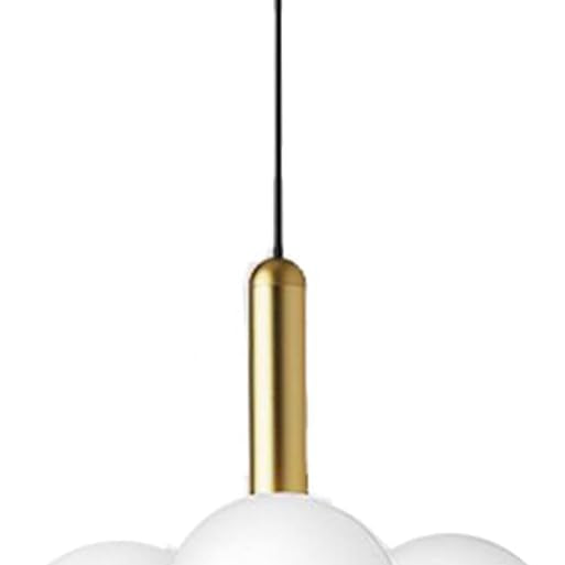 Modern pendant light with three white glass spheres and gold accents on a white background