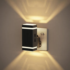 Modern wall-mounted light fixture on a neutral wall