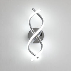 Modern wall light fixture with a spiral design on a white background