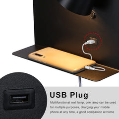 Multifunctional wall lamp with USB plug charging a phone on a dark surface.