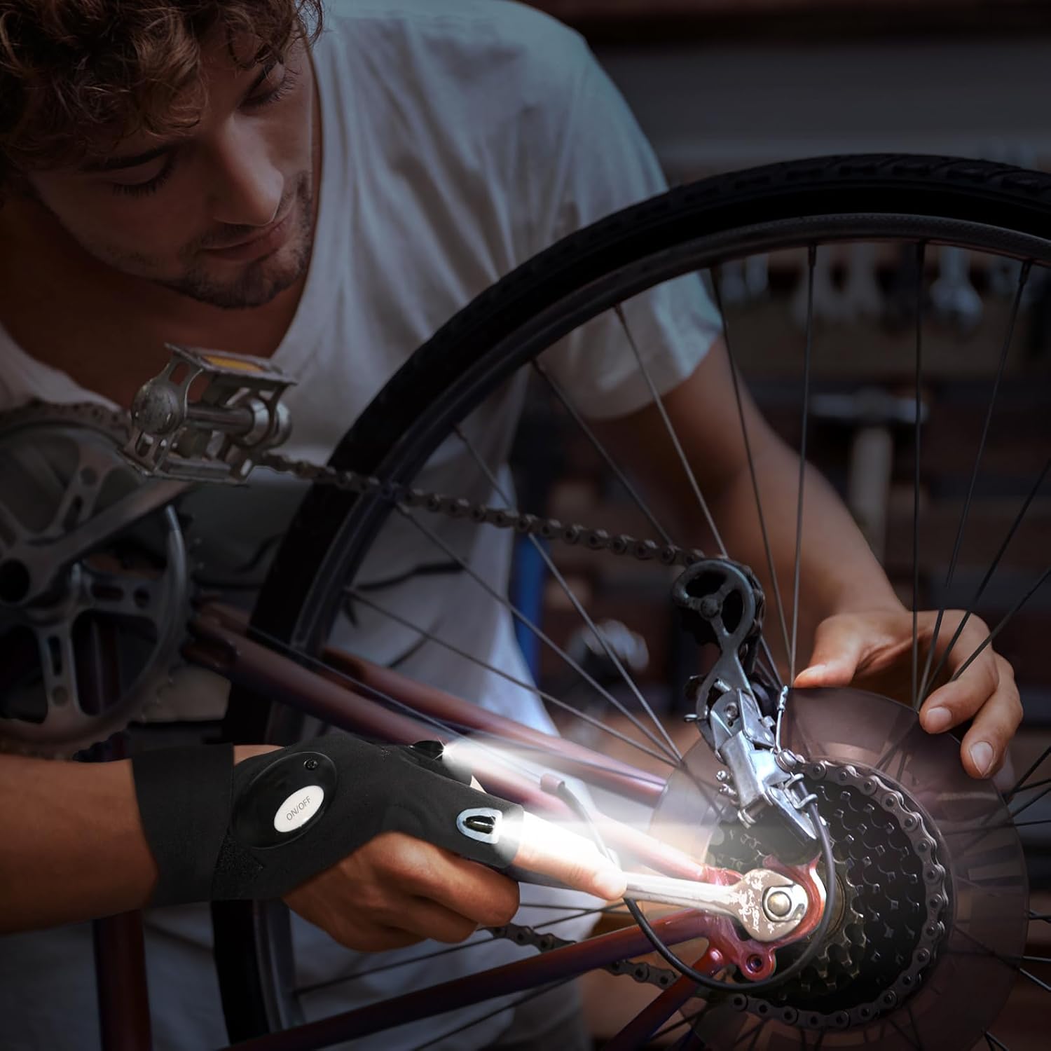 Person working on a bicycle wheel with a close-up of the gear mechanism