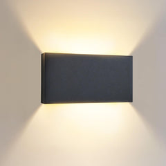 Rectangular wall light fixture on a plain wall