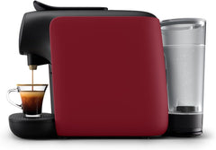 Red coffee machine with a glass of water and a cup of coffee on a white background
