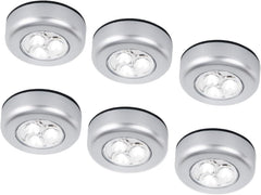 Set of six round silver LED lights on a white background