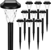 Set of solar-powered outdoor lights on a white background