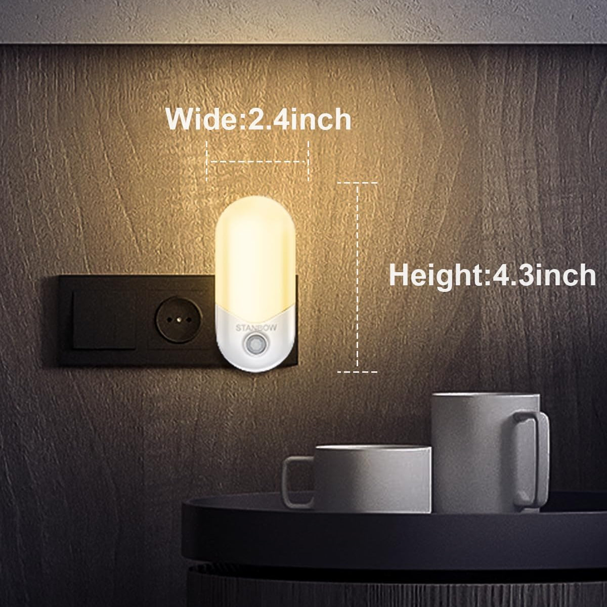 Small night light on a wall with dimensions labeled, placed next to a mug.