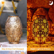 Solar-powered decorative lantern with floral cutout design, shown during day and night.