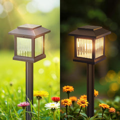Solar-powered outdoor lamp with green and yellow light on a blurred garden background